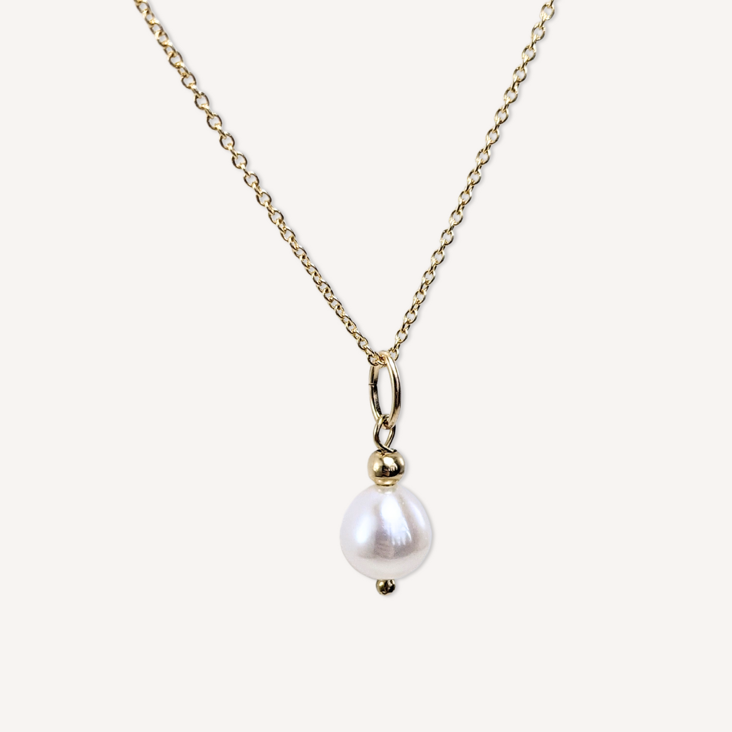 Natural large white freshwater pearl pendant on a 14k gold-filled micro chain necklace close-up