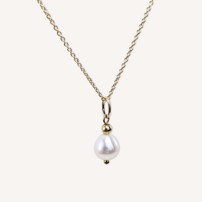 Natural large white freshwater pearl pendant on a 14k gold-filled micro chain necklace close-up