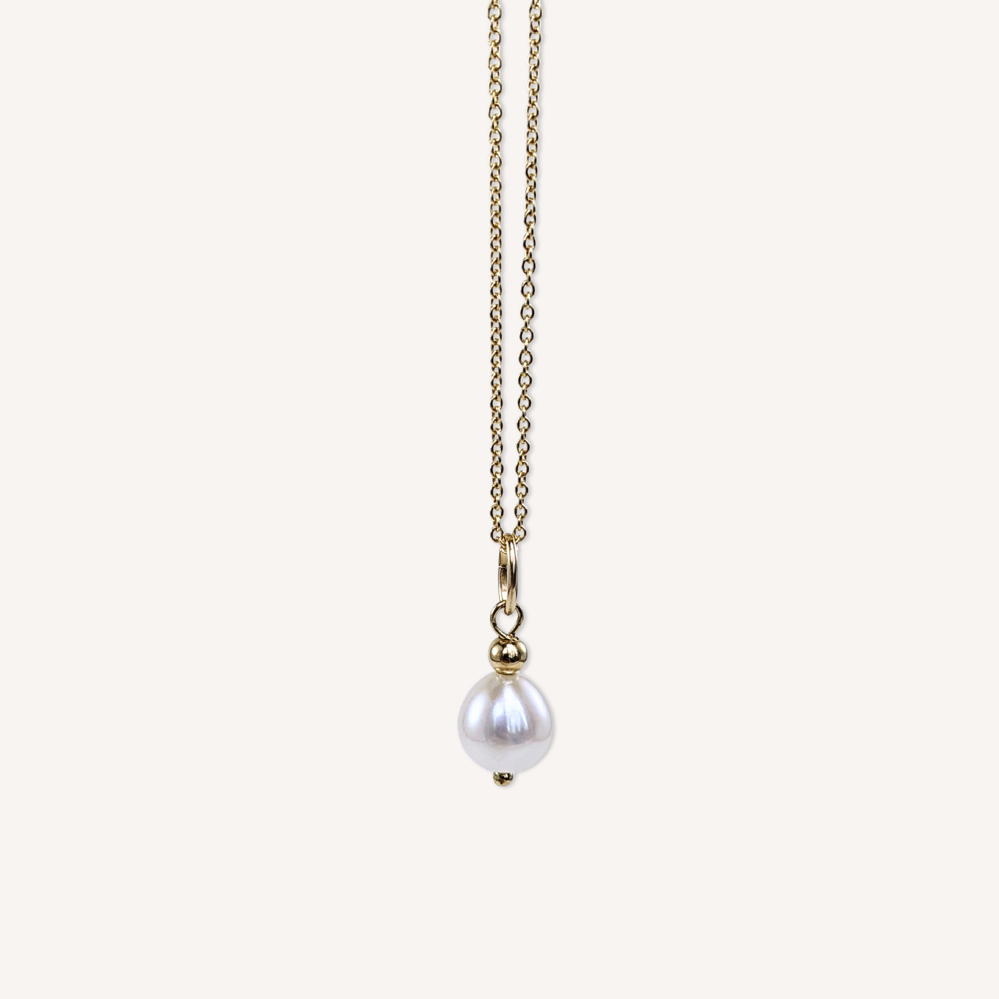Natural large white freshwater pearl pendant on a 14k gold-filled micro chain necklace front